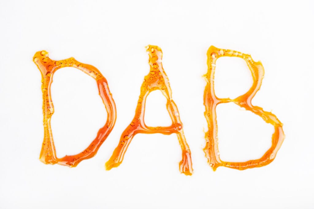 The word dab written with cannabis concentrate