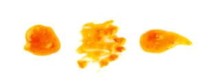 an assortment of cannabis concentrates on a white background